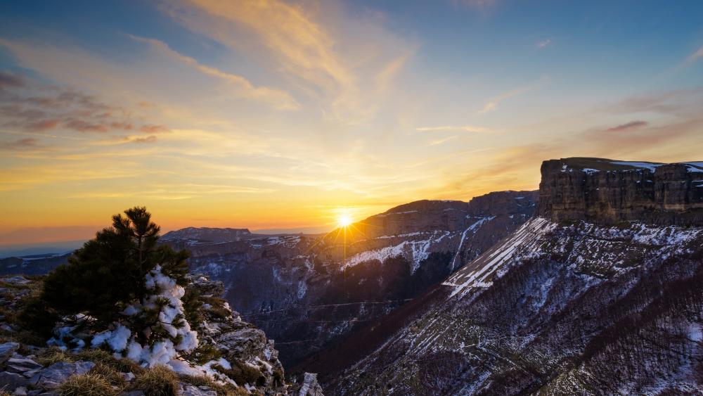 Majestic Sunrise Over Snowy Mountains wallpaper