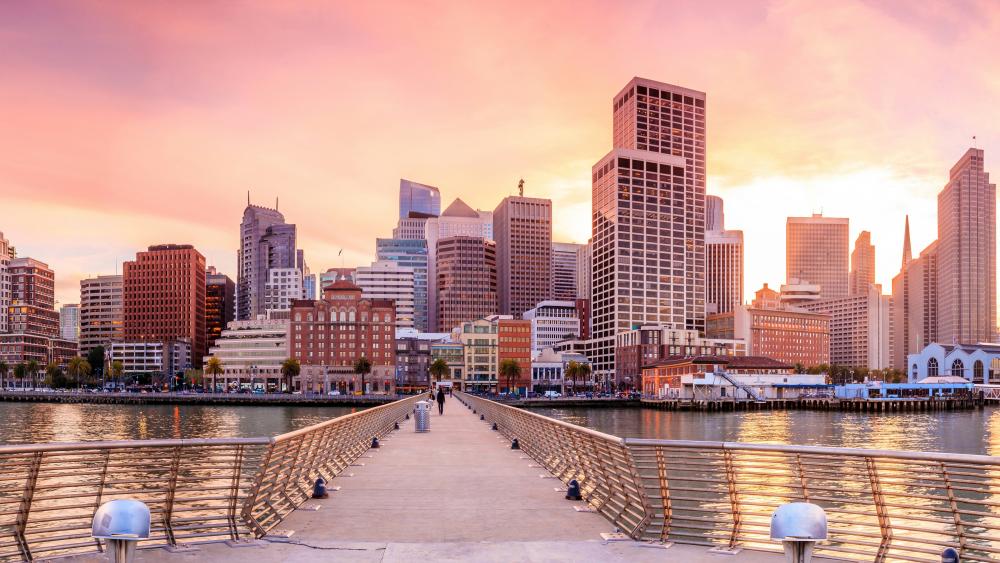 Vibrant Sunset Over City Skyline wallpaper