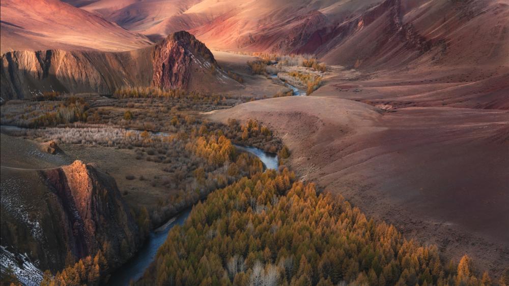 Stunning River Carving Through Autumn Valleys wallpaper
