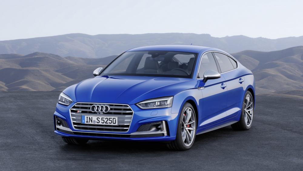 Sleek Blue Audi S5 on Scenic Terrain wallpaper