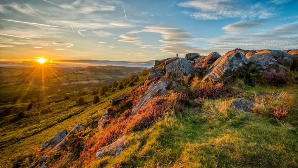Majestic Sunset Over Rocky Landscape wallpaper