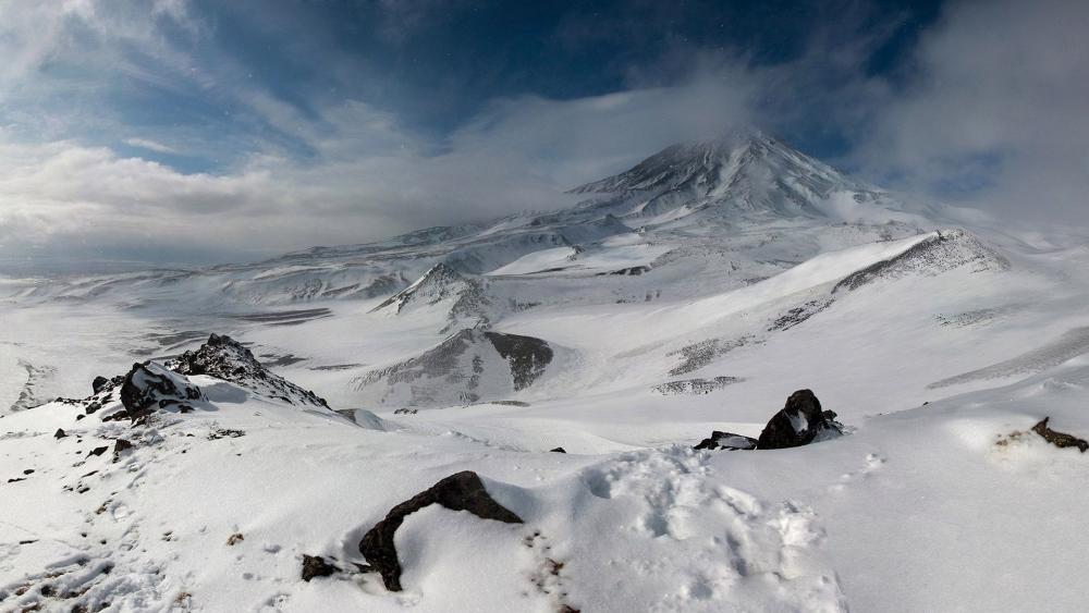 Majestic Snow-Capped Volcano in Winter Beauty wallpaper
