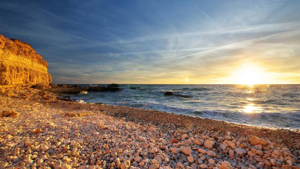 Serene Sunset Over Tranquil Shoreline wallpaper