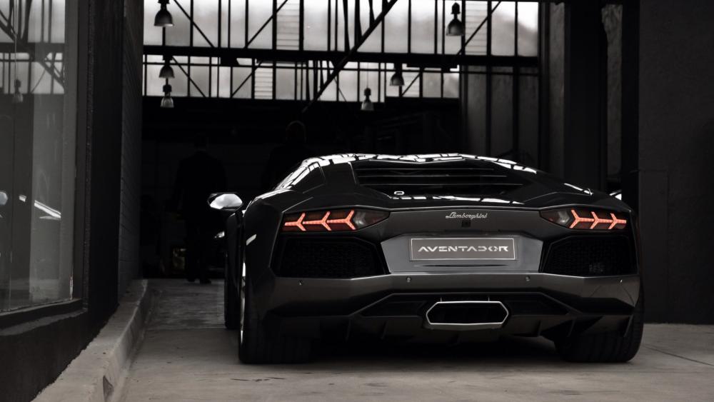 Sleek Lamborghini Aventador in a Modern Garage Setting wallpaper