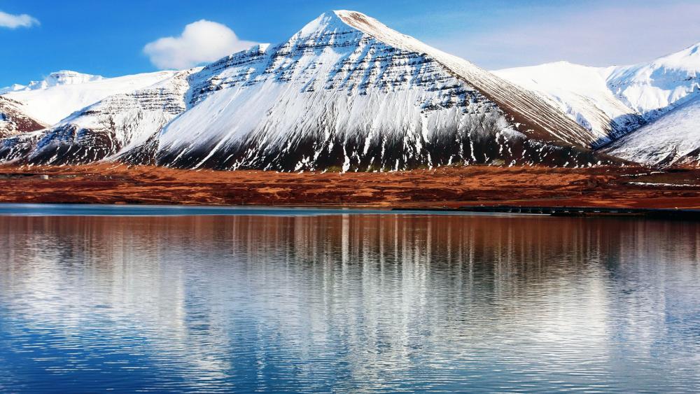 Majestic Snow-Capped Mountains by Tranquil Waters wallpaper