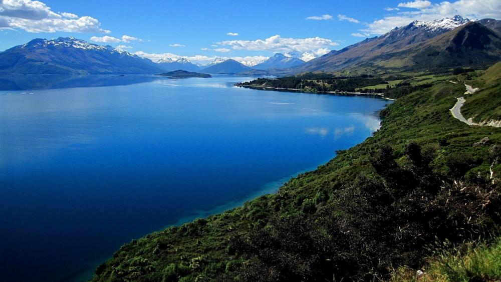 Serene Mountain Lake View with Lush Mountainside wallpaper