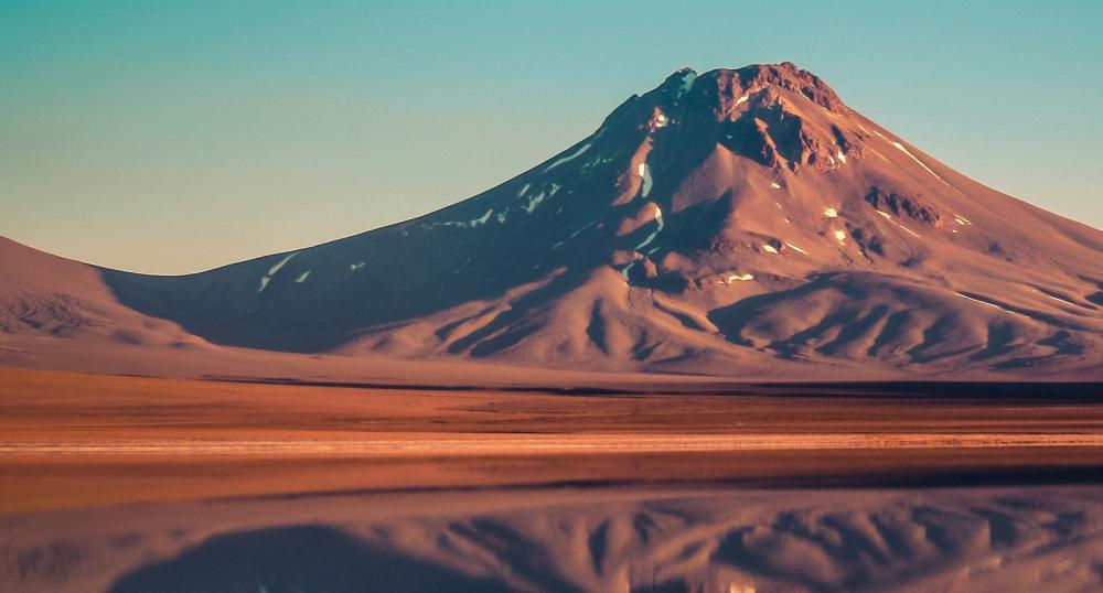 Majestic Mountain Reflected in Tranquil Waters wallpaper