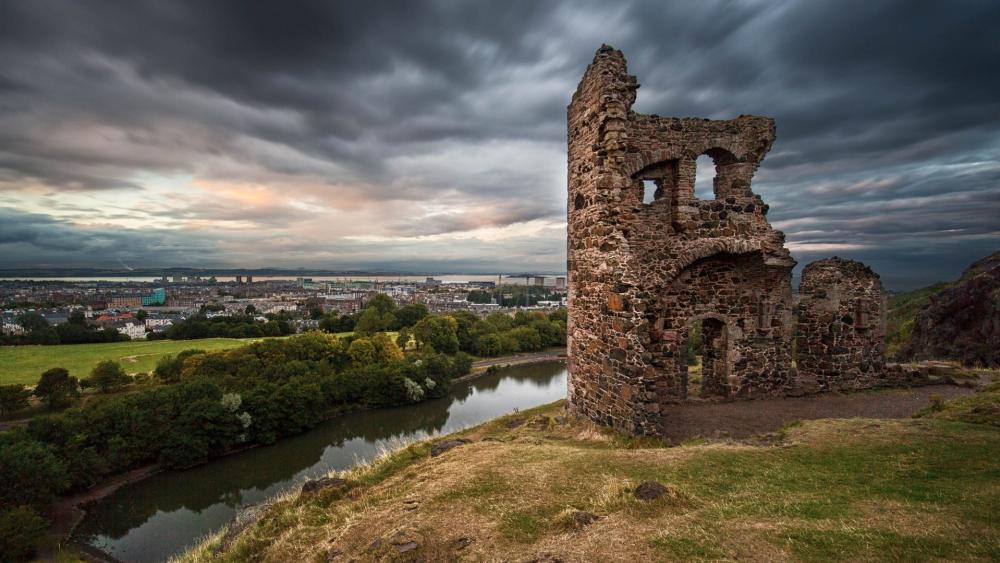 Ancient Ruins Overlooking a Serene Landscape wallpaper
