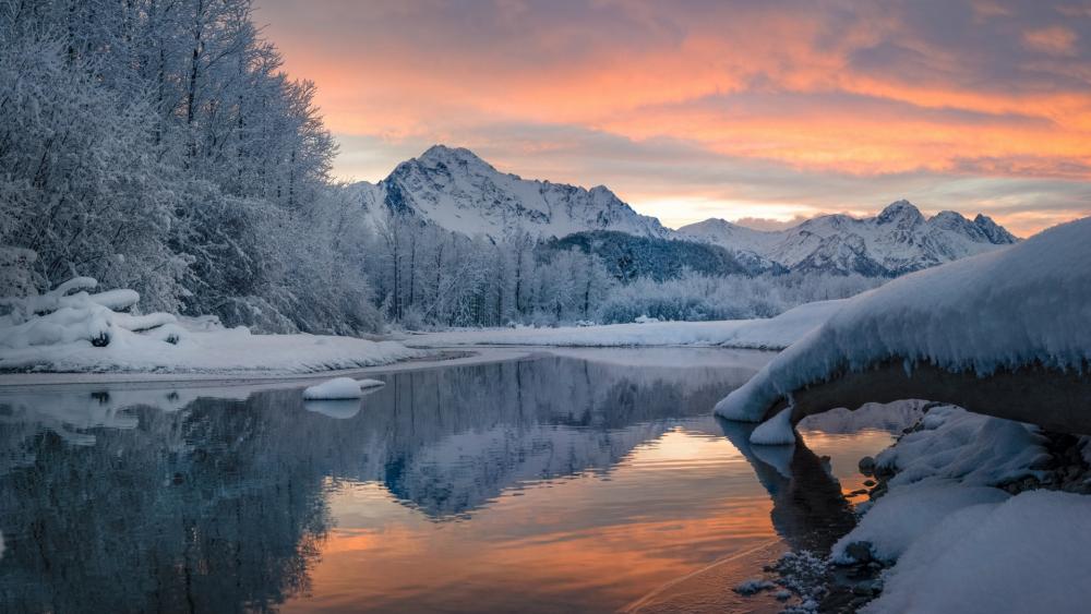 Serene Winter Landscape with Reflections in Nature's Beauty wallpaper