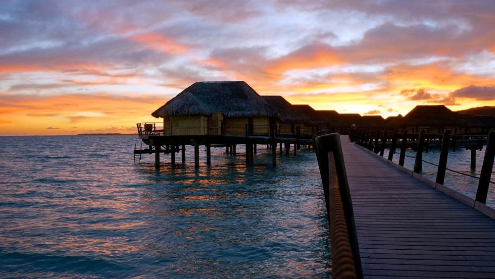 Tranquil Overwater Bungalows at Sunset wallpaper