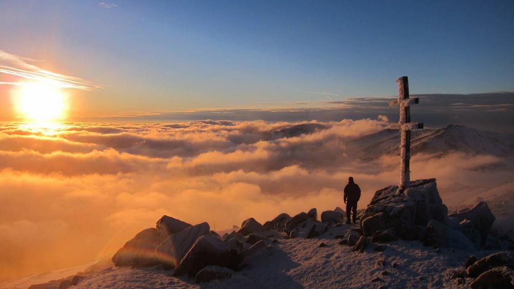 Majestic Sunrise Over Frozen Mountains wallpaper