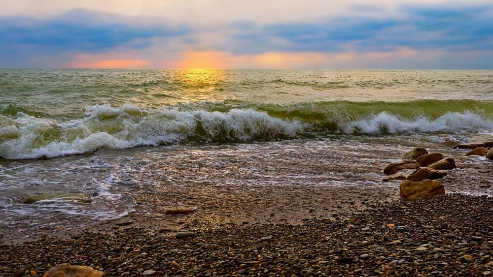 Tranquil Waves at Sunset Over the Shoreline wallpaper