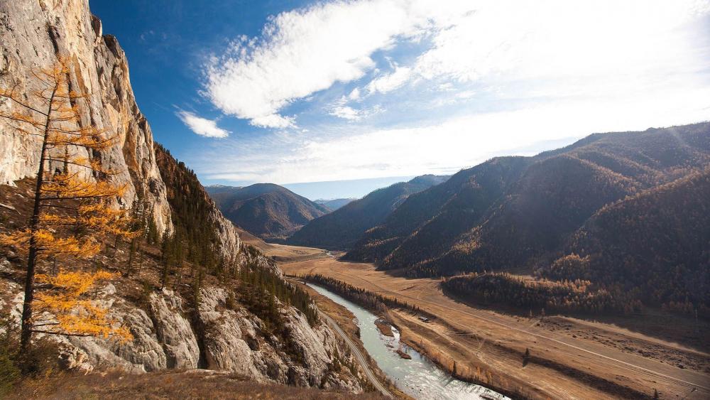 Majestic Mountain Valley Under Bright Blue Sky wallpaper