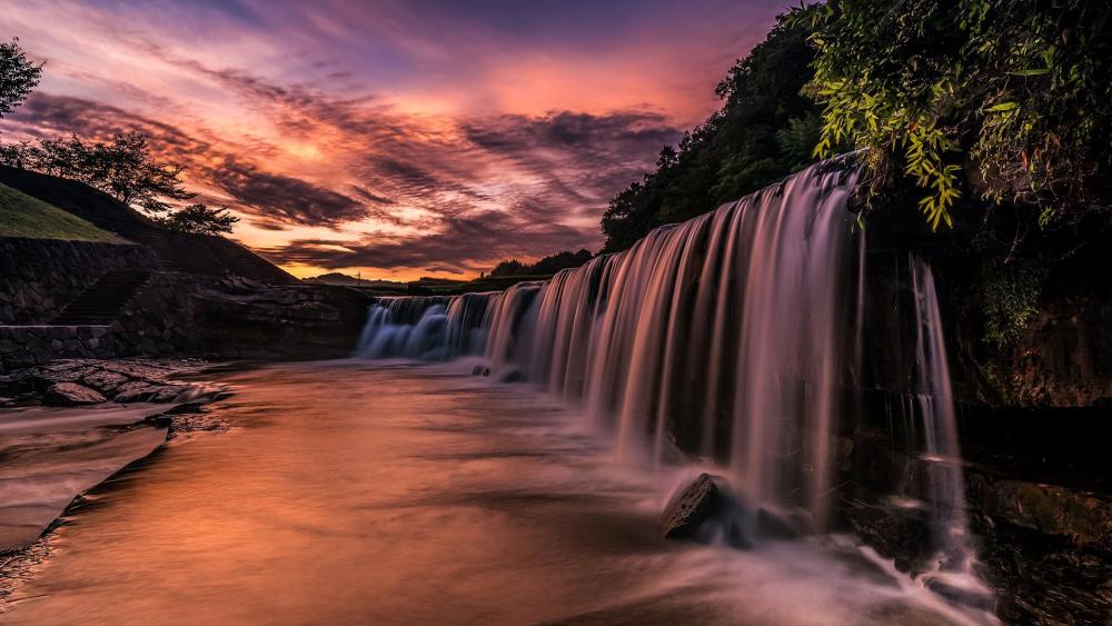 Majestic Waterfall at Sunset wallpaper