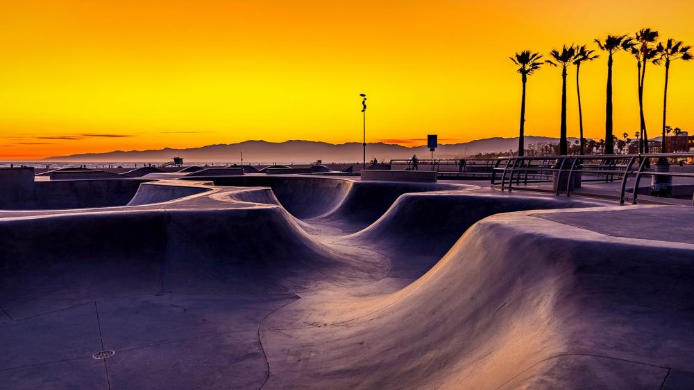 Golden Sunset over the Urban Skatepark Scene wallpaper