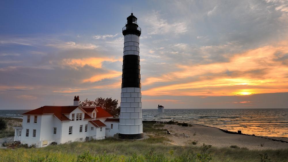 Serene Sunset at the Lighthouse wallpaper