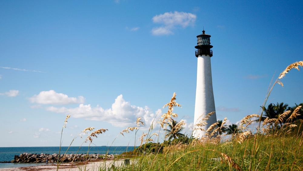 Coastal Serenity with a Lighthouse View wallpaper