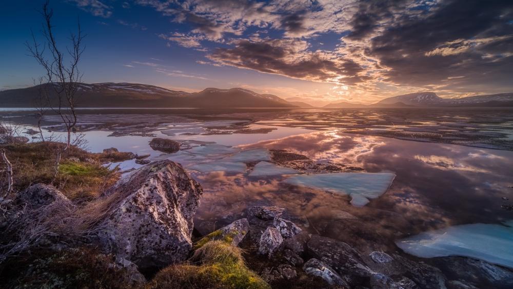 Majestic Sunrise Over Icy Landscape wallpaper
