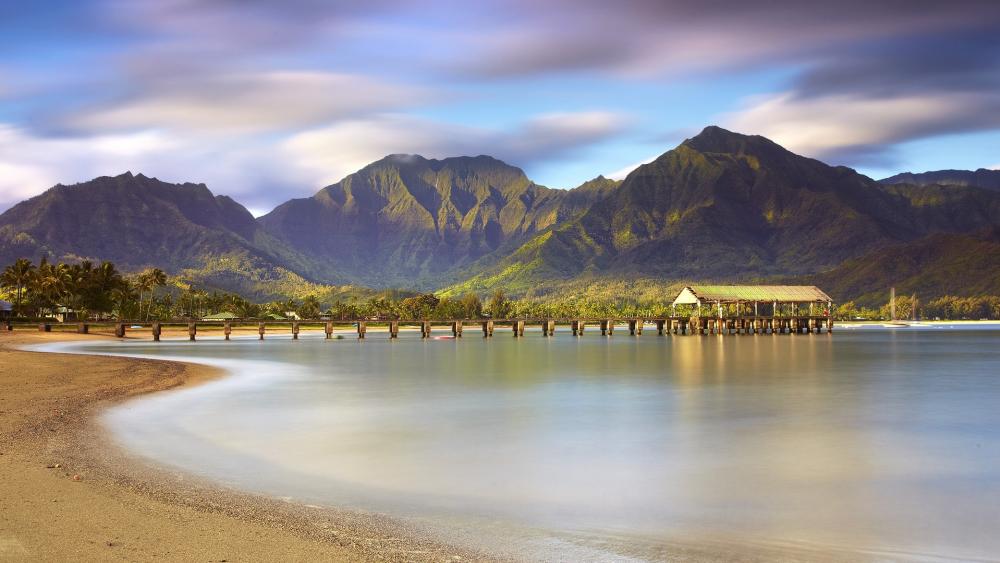 Serene Coastal Landscape with Majestic Mountains wallpaper
