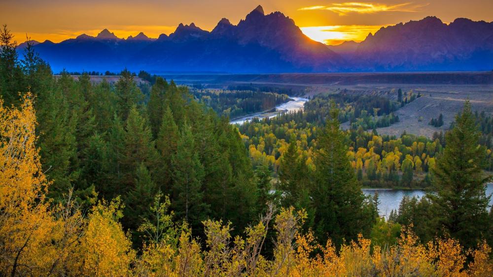 Majestic Sunset Over Serene Mountains and River wallpaper