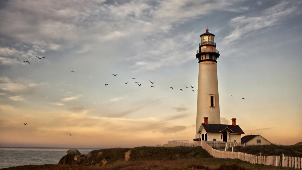 Serene Lighthouse by the Shoreline wallpaper