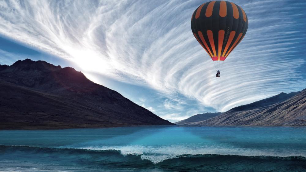 Serene Hot Air Balloon Above Vibrant Waters wallpaper