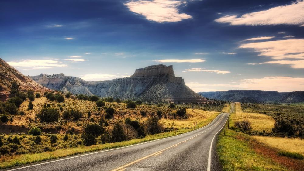 Endless Road Through Majestic Landscapes wallpaper