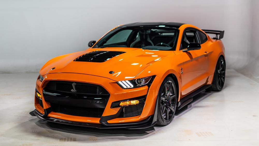 Bold and Dynamic Orange Sports Car Wallpaper wallpaper