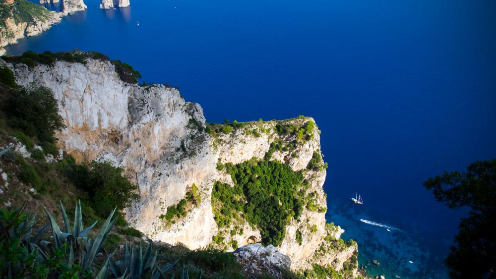 Breathtaking Coastal View with Deep Blue Waters wallpaper