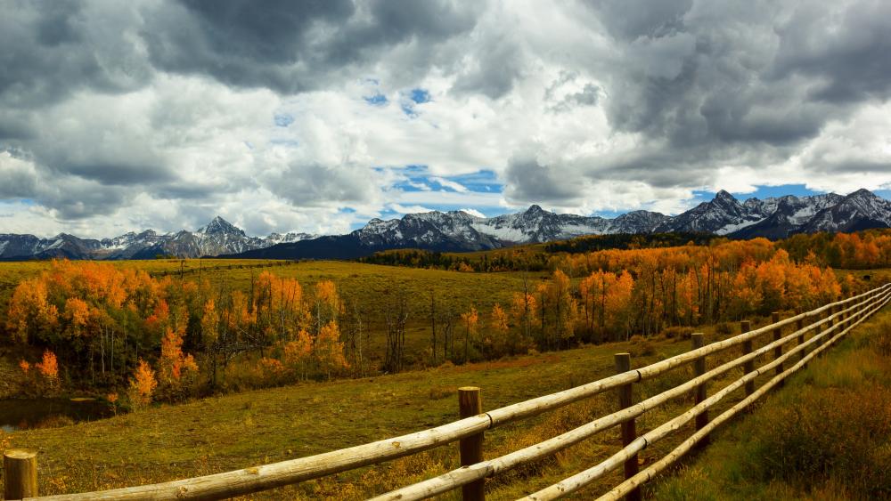 Breathtaking Autumn Landscape with Mountains and Clouds wallpaper