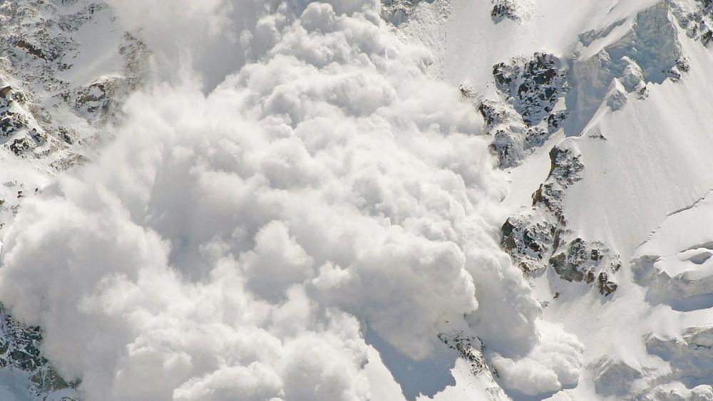 Majestic Avalanche Transforming Snowy Peaks wallpaper