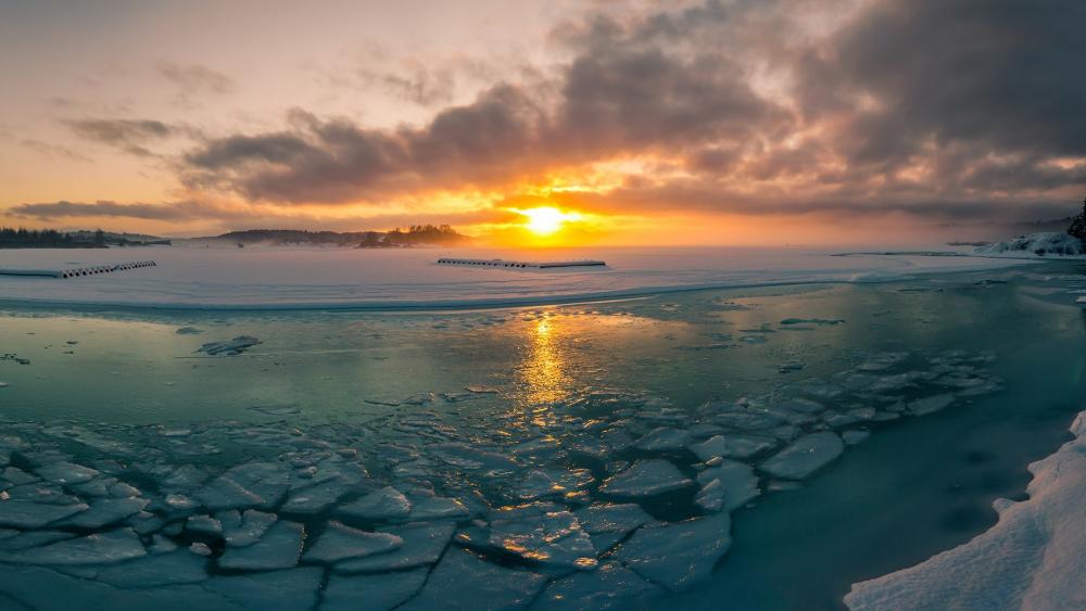 Serene Winter Sunrise Over Frozen Waters wallpaper