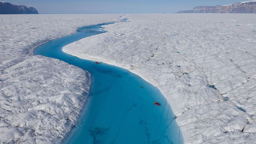 Majestic Glacial River Flowing Through Ice Fields wallpaper