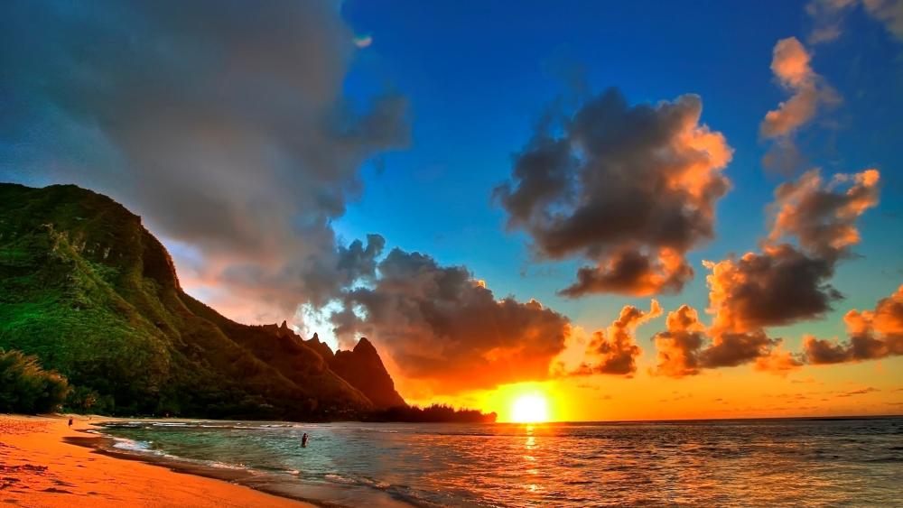 Serene Sunset Over Tropical Beach Views wallpaper