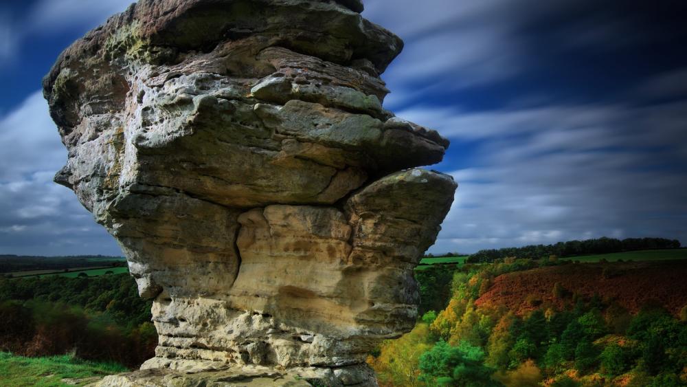 Majestic Rock Formation Against a Vibrant Sky wallpaper
