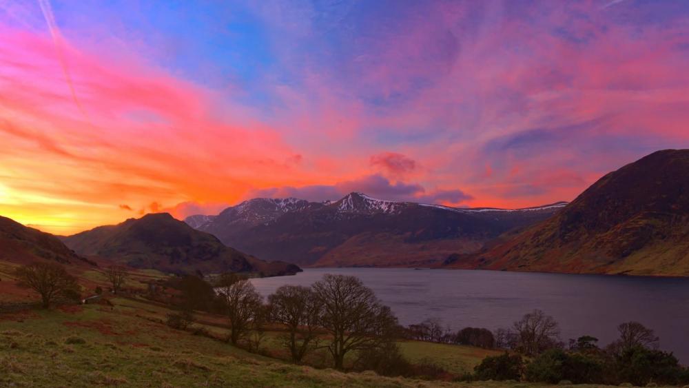 Vibrant Sunset Over Serene Lake and Mountains wallpaper