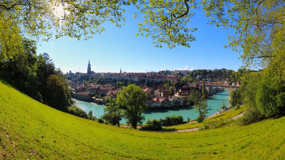 Serene Riverside Townscape in Spring wallpaper