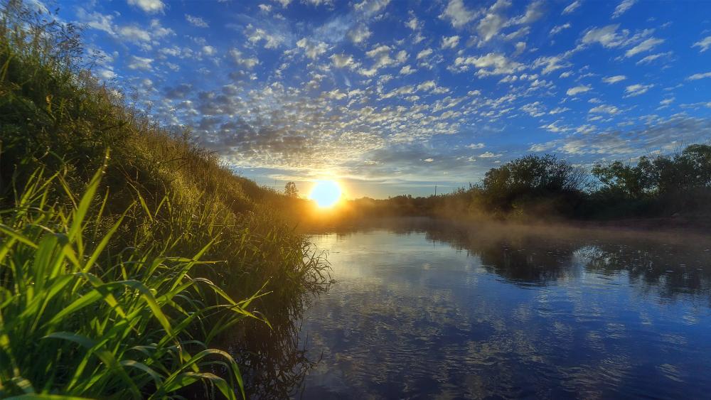 Tranquil Sunrise Over Serene River Scene wallpaper