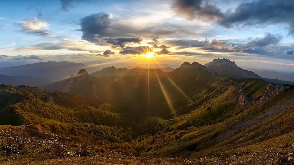 Majestic Mountain Sunrise Over Lush Valleys wallpaper