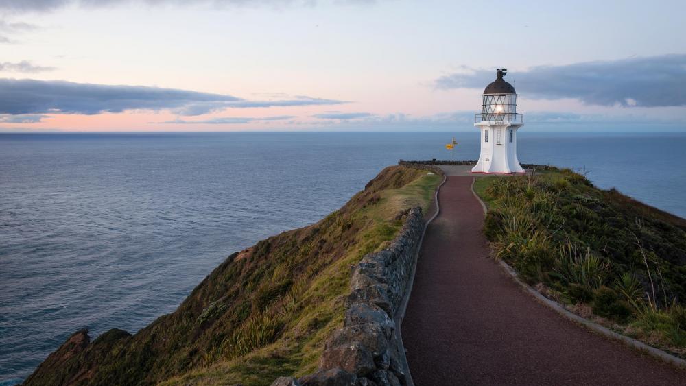Tranquil Lighthouse Overlooking the Ocean wallpaper