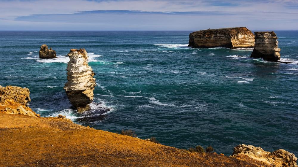 Majestic Coastal Cliffs and Turquoise Waves wallpaper