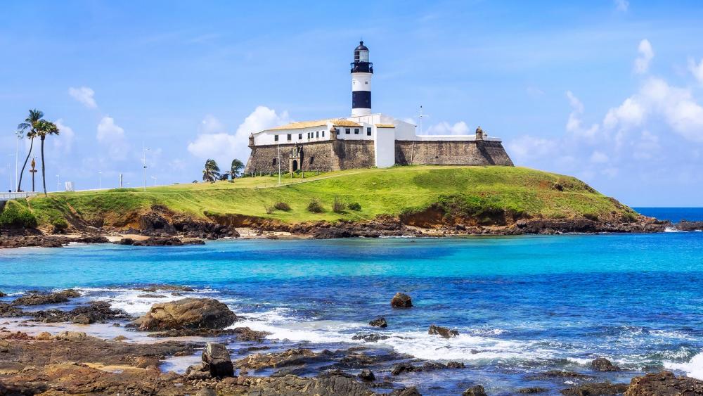 Serene Coastal Lighthouse by the Ocean Waves wallpaper