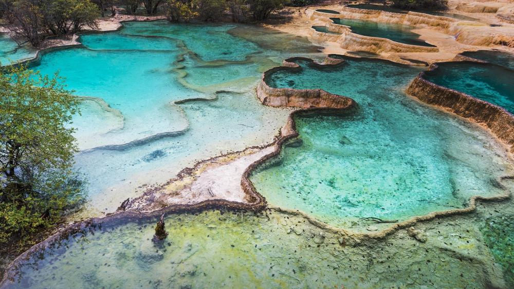 Breathtaking Natural Pools in Vibrant Colors wallpaper