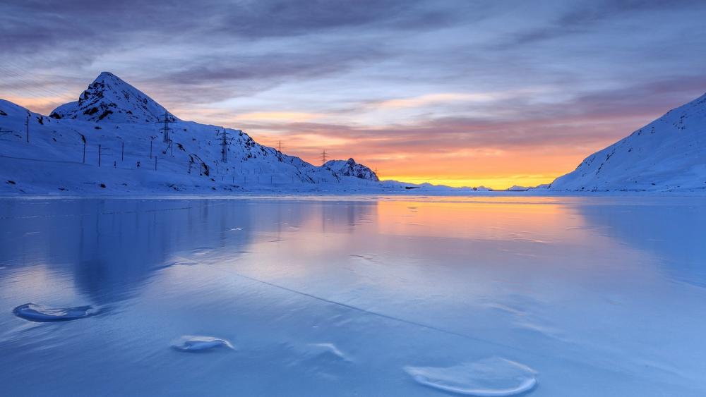Serene Frozen Lake at Sunrise wallpaper