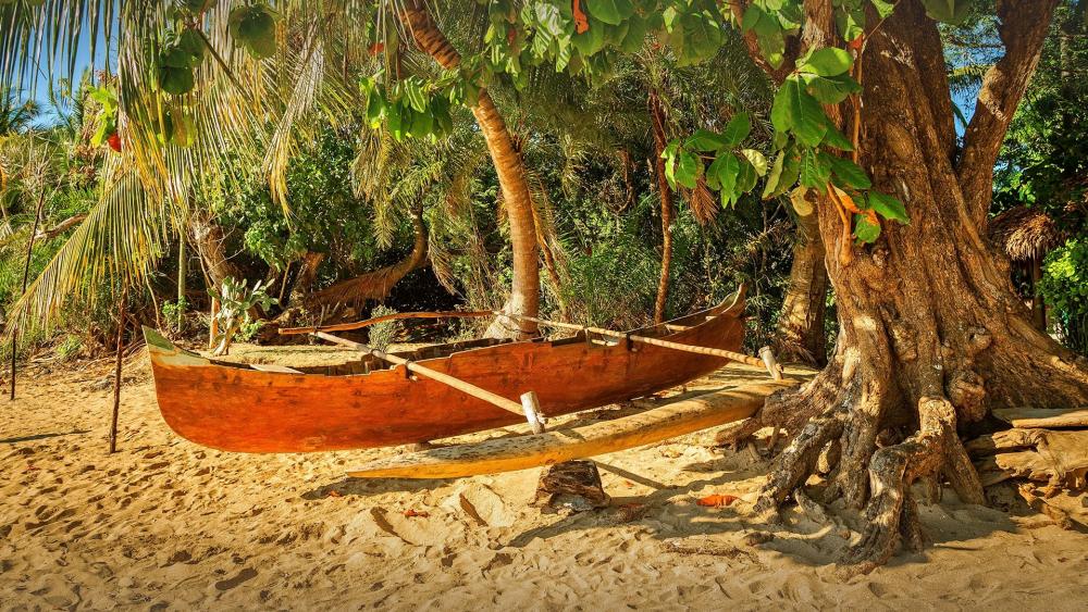 Tranquil Beach Scene with a Wooden Boat wallpaper