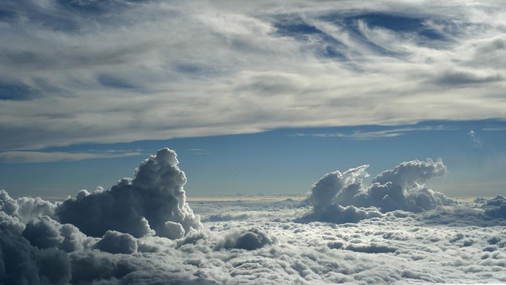 Majestic Clouds in a Tranquil Sky wallpaper