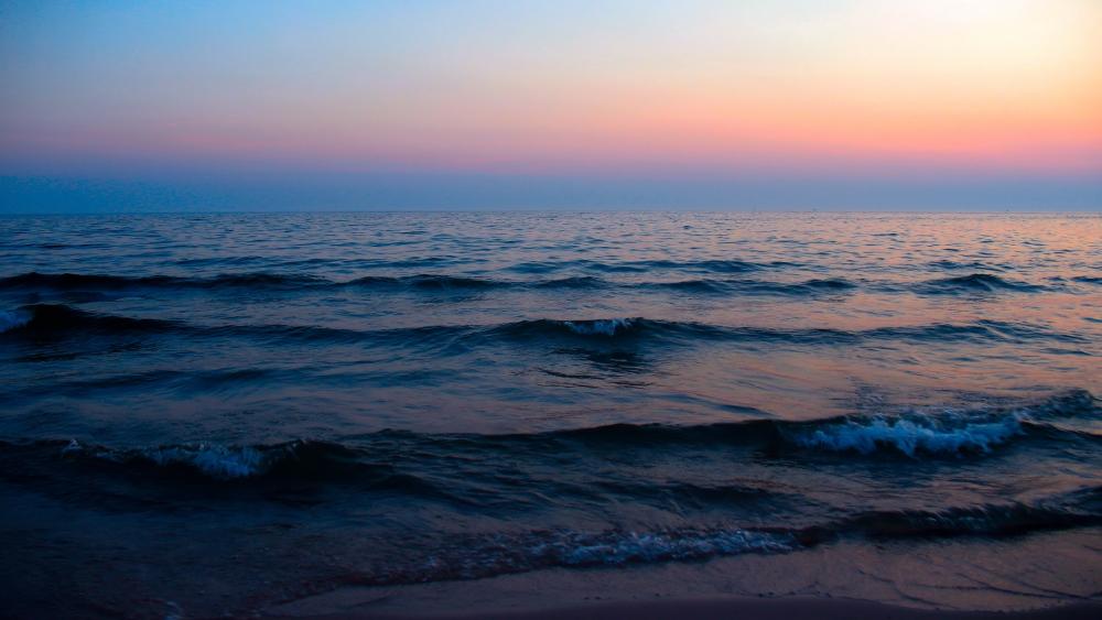 Serene Waves Under a Twilight Sky wallpaper