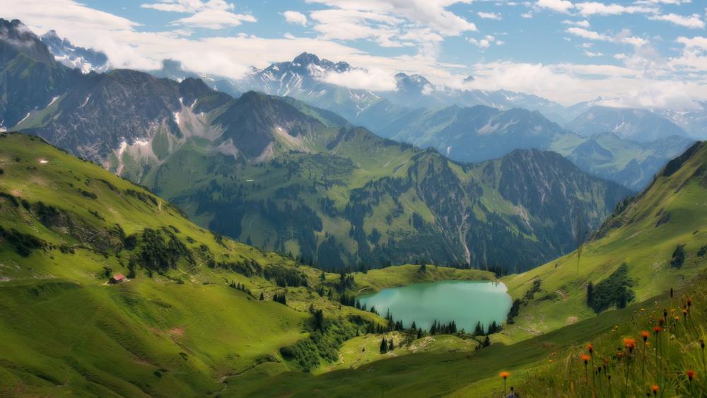 Serene Mountain Lake Amidst Majestic Peaks wallpaper