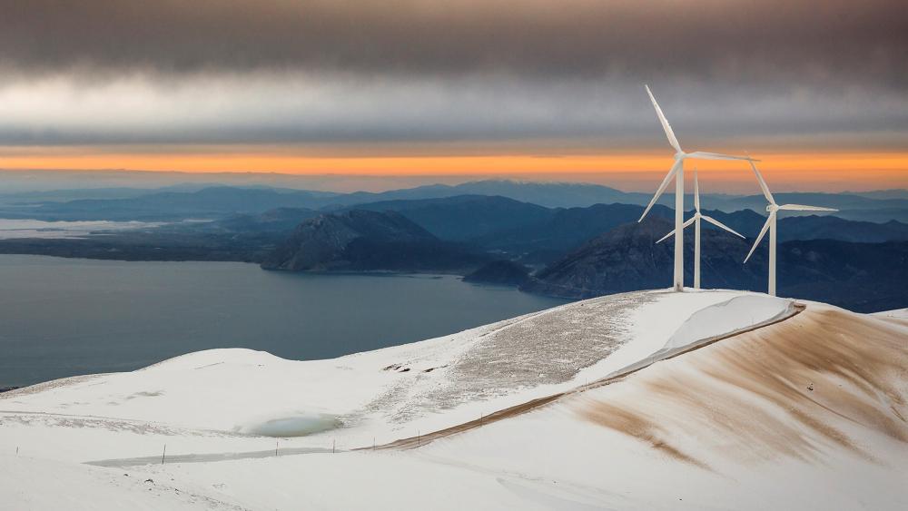 Majestic Wind Turbines in Snowy Landscape wallpaper