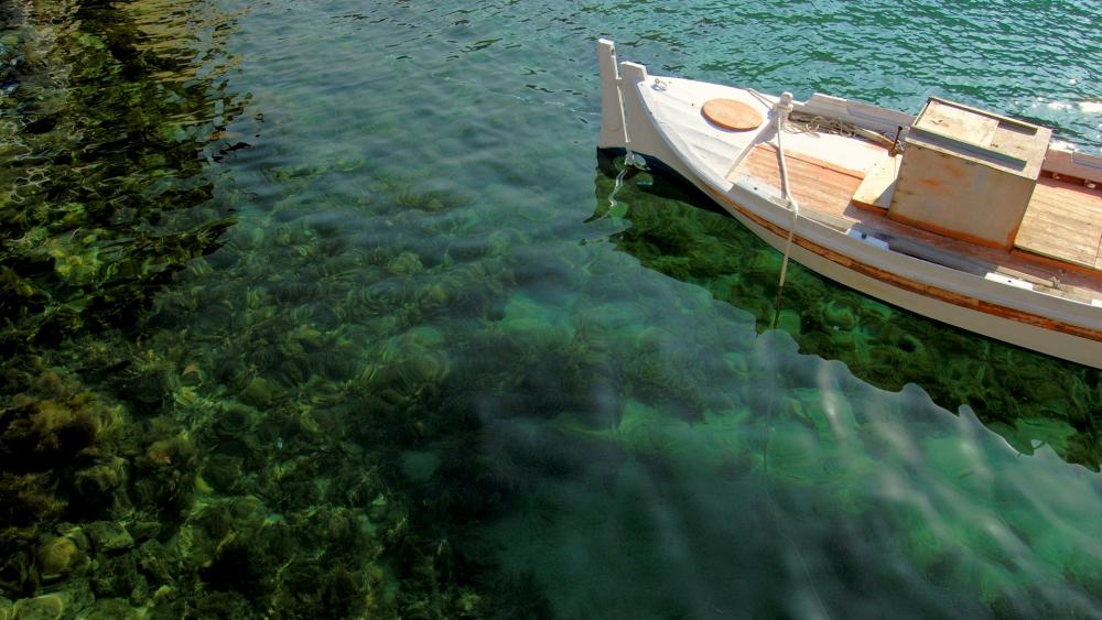 Serene Waters and a Quiet Boat wallpaper